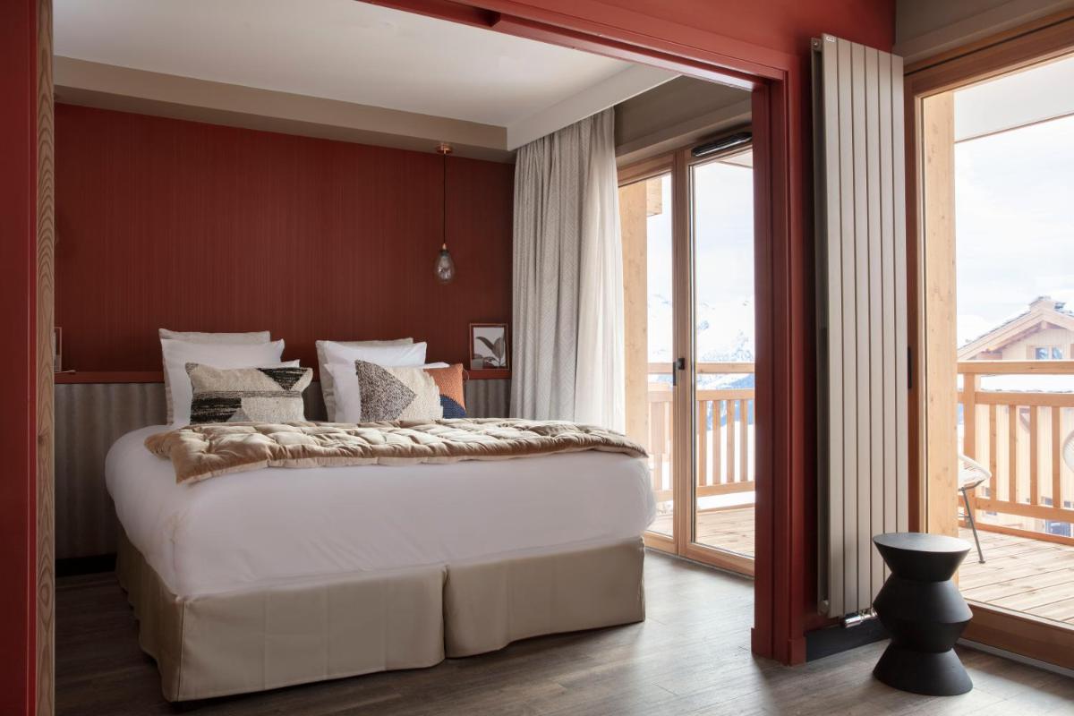 Un ou plusieurs lits dans un hébergement de l'établissement Grandes Rousses Hotel & Spa
