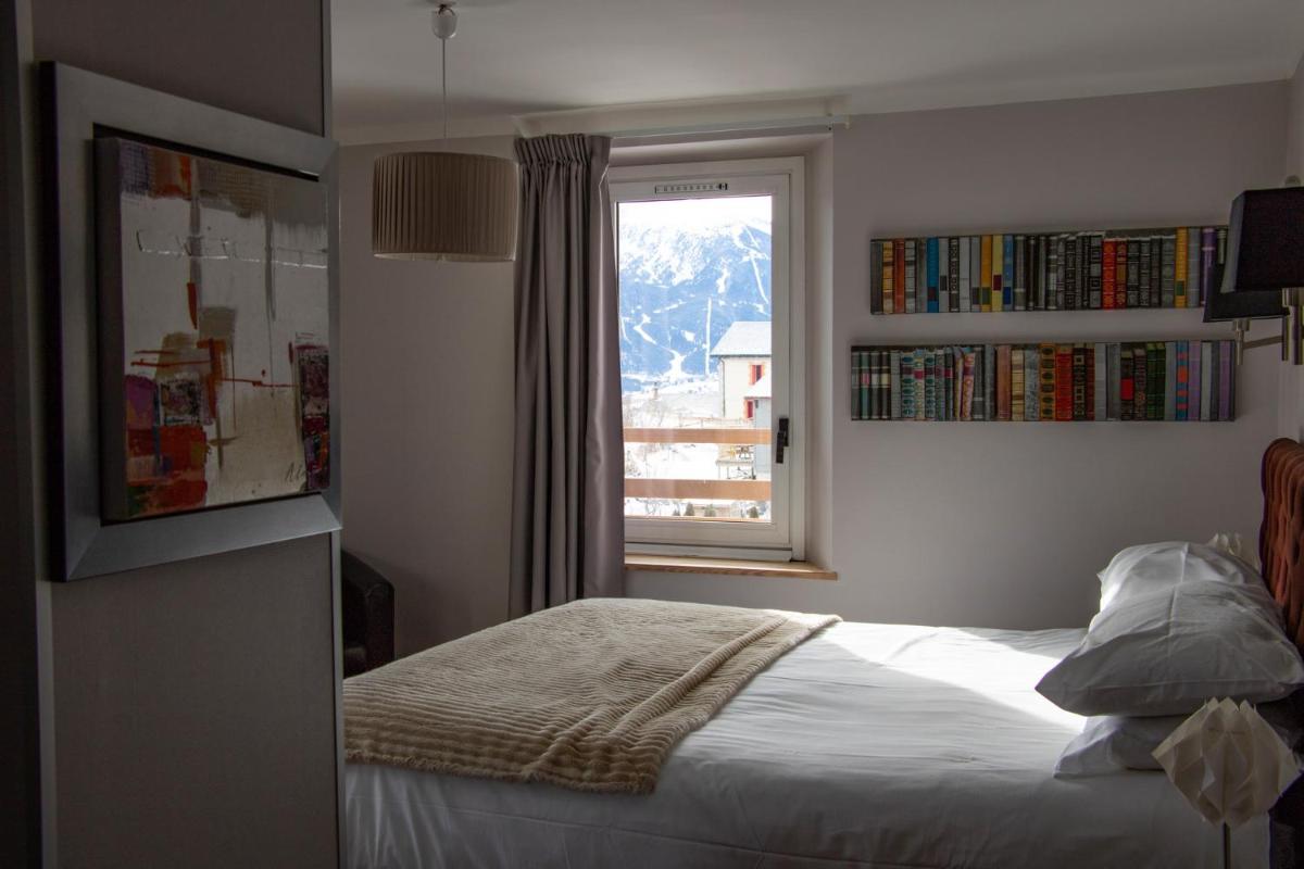 Un ou plusieurs lits dans un hébergement de l'établissement Hotel Corrieu