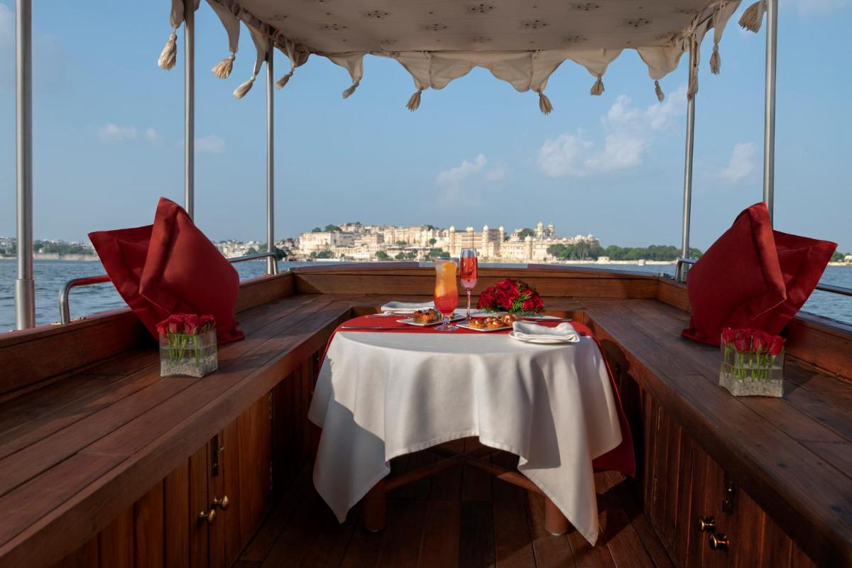 a table on the deck of a boat at Trident Udaipur in Udaipur