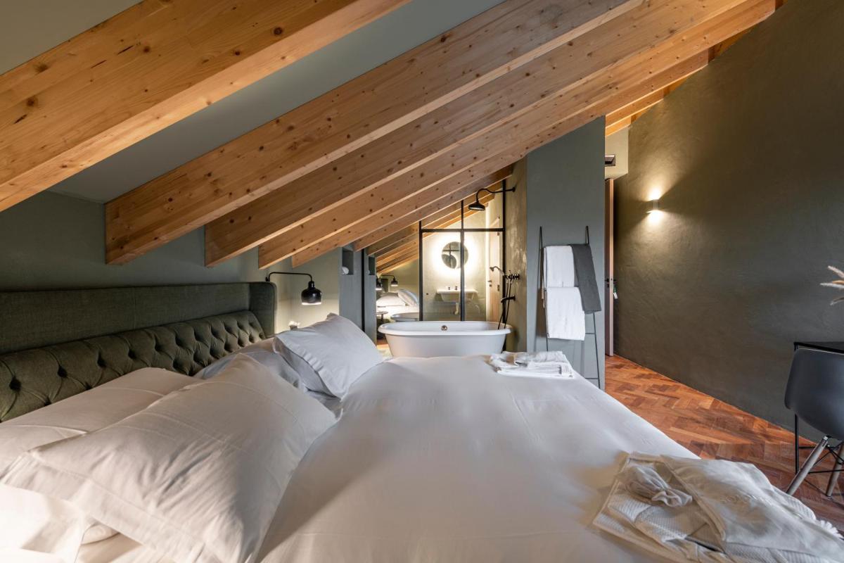 Uma cama ou camas num quarto em Herdade da Malhadinha Nova - Relais & Châteaux