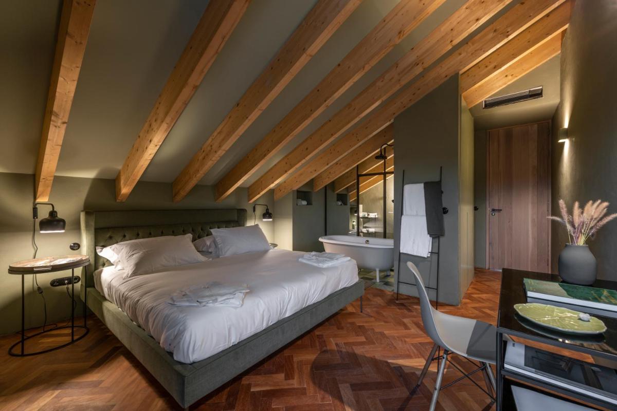 Uma cama ou camas num quarto em Herdade da Malhadinha Nova - Relais & Châteaux