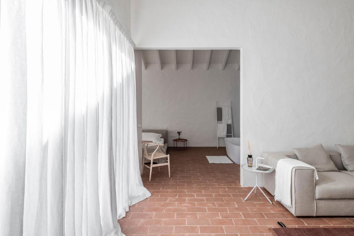 Uma área de estar em Herdade da Malhadinha Nova - Relais & Châteaux