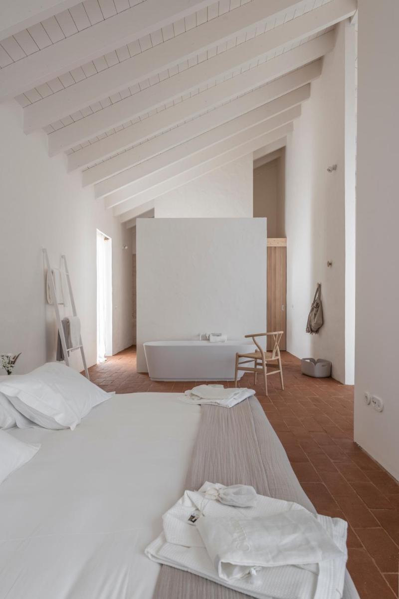 Uma cama ou camas num quarto em Herdade da Malhadinha Nova - Relais & Châteaux