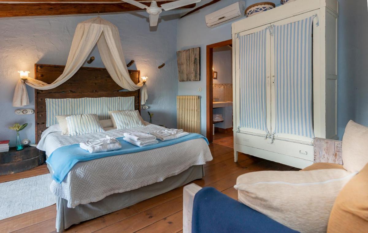 Cama o camas de una habitación en Les Vinyes Alojamiento Rural Boutique & SPA
