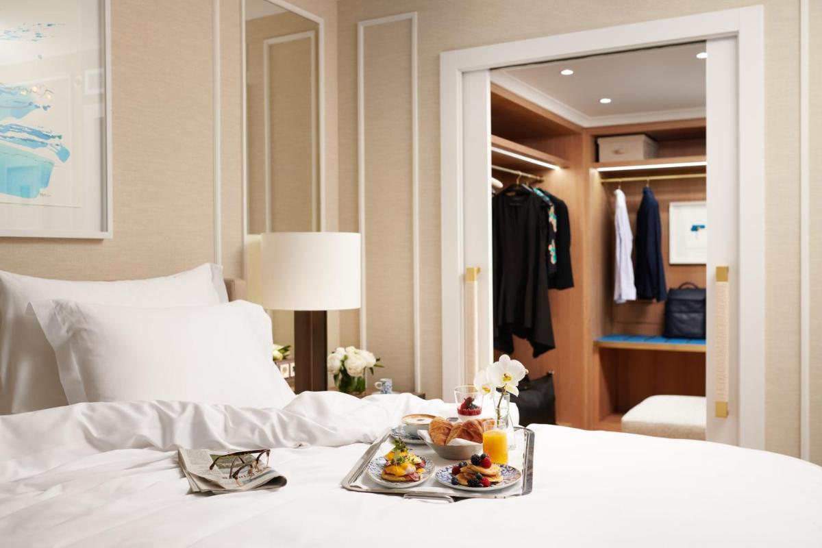 Uma cama ou camas num quarto em Corinthia Lisbon