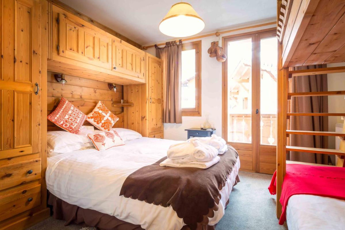 Un ou plusieurs lits dans un hébergement de l'établissement Hôtel et Chalet Au Coin Du Feu Chilly Powder
