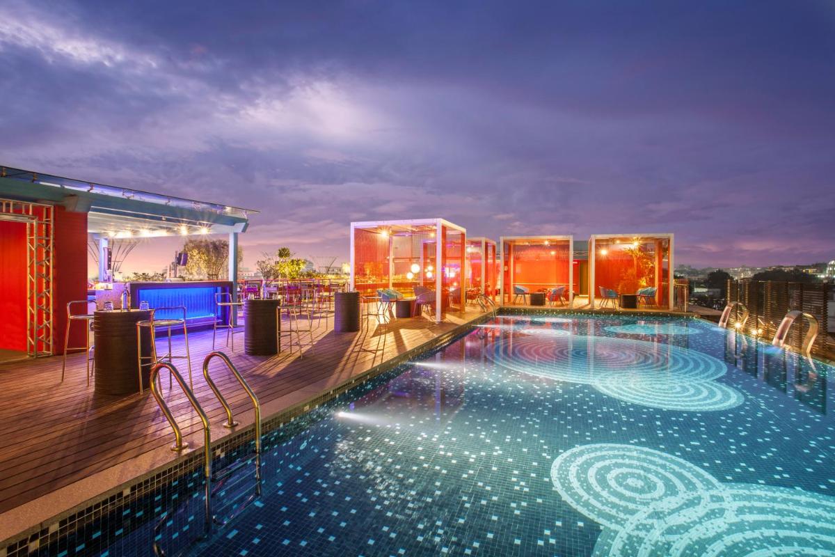 a large swimming pool on the roof of a building at Hyatt Place Hyderabad Banjara Hills in Hyderabad a large swimming pool on the roof of a building at Hyatt Place Hyderabad Banjara Hills in Hyderabad