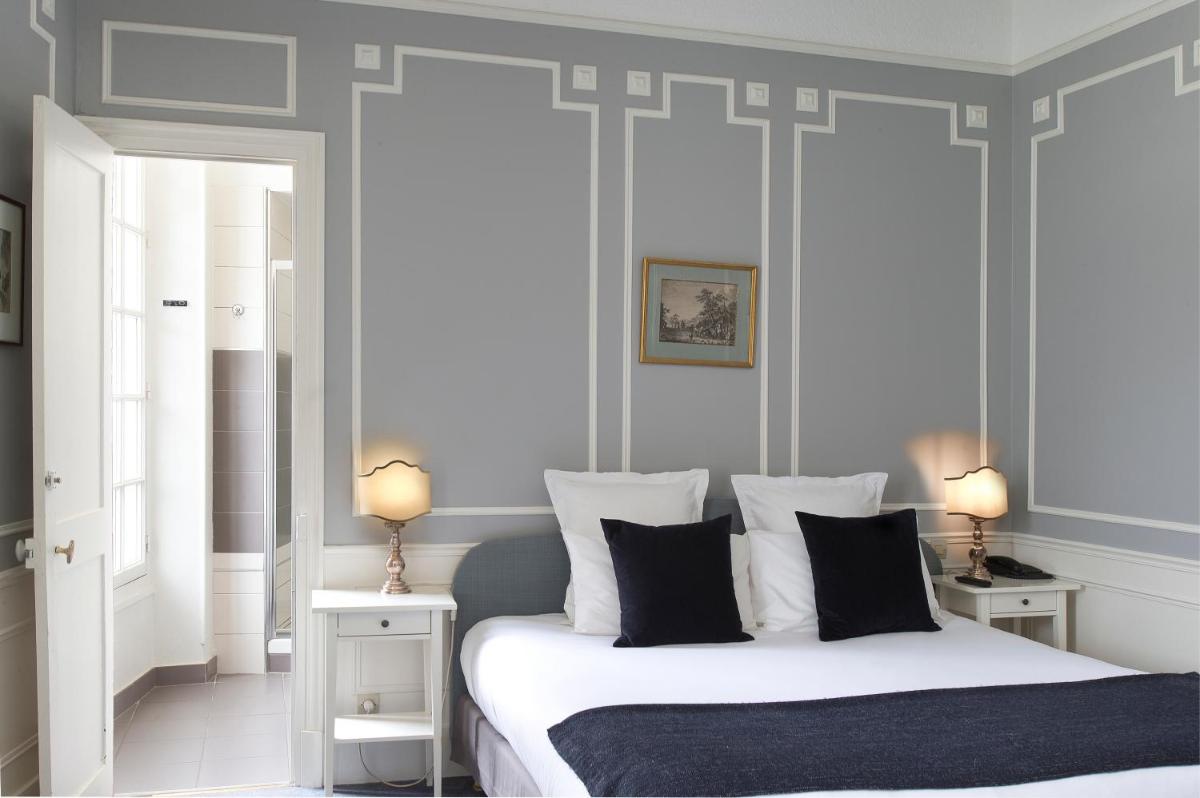 Un ou plusieurs lits dans un hébergement de l'établissement Château Hôtel, Restaurant & Spa De La Commanderie