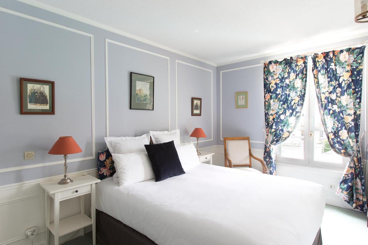 Un ou plusieurs lits dans un hébergement de l'établissement Château Hôtel, Restaurant & Spa De La Commanderie