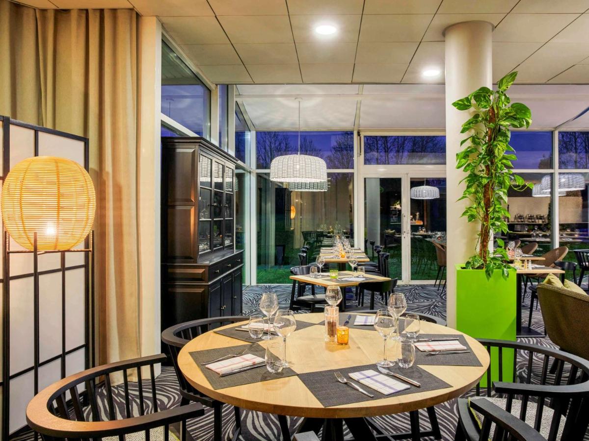 Restaurant ou autre lieu de restauration dans l'établissement Novotel Senart Golf De Greenparc