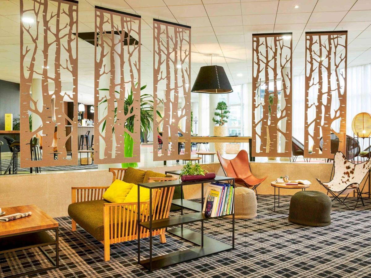 Coin salon dans l'établissement Novotel Senart Golf De Greenparc