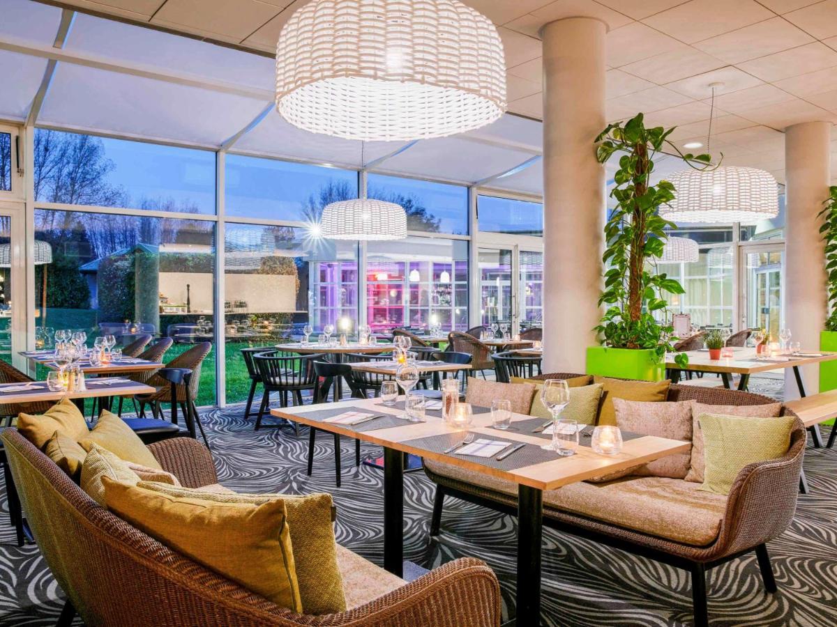 Coin salon dans l'établissement Novotel Senart Golf De Greenparc