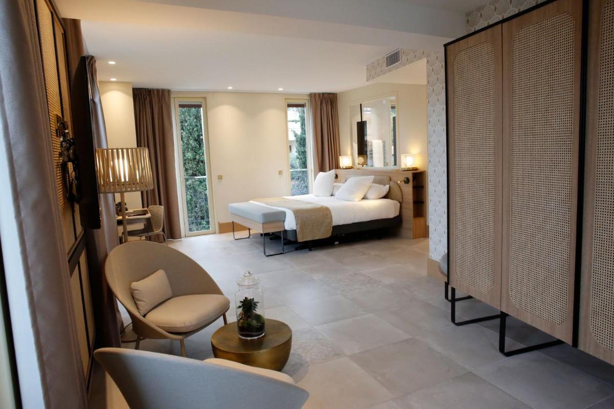 Un ou plusieurs lits dans un hébergement de l'établissement Splendid Hôtel & Spa