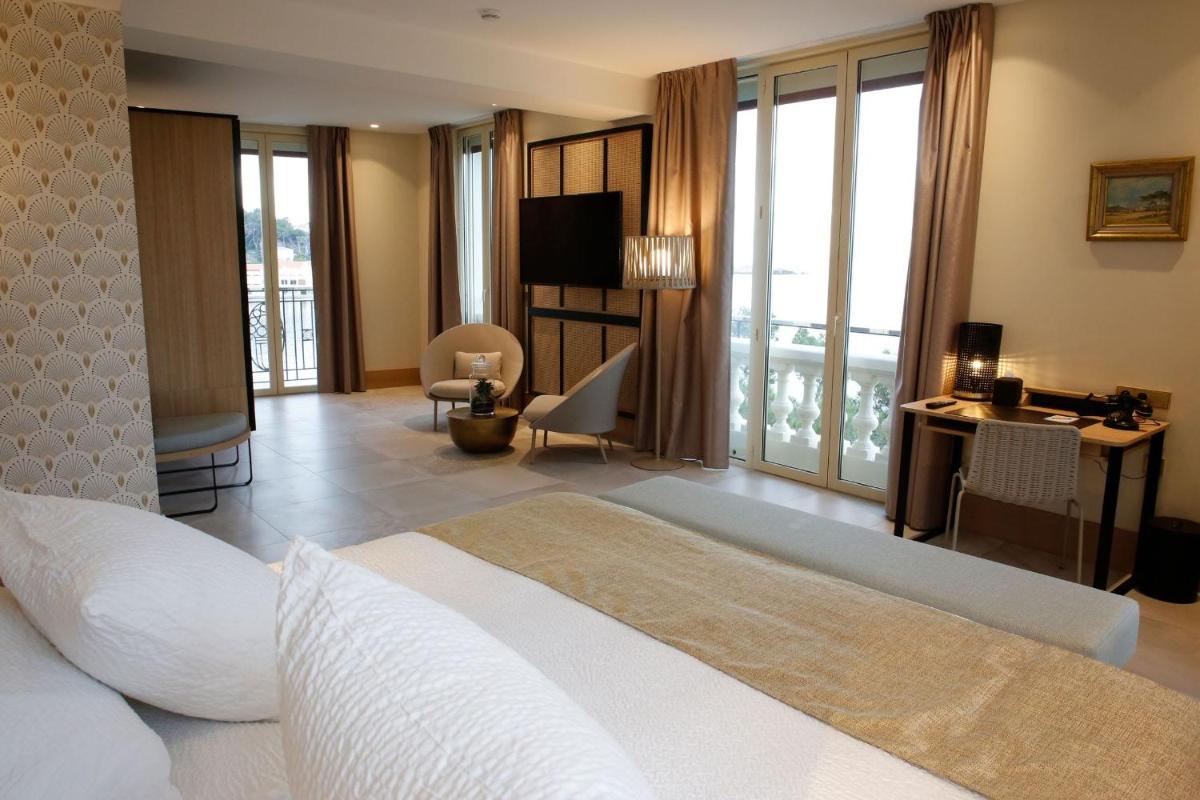 Un ou plusieurs lits dans un hébergement de l'établissement Splendid Hôtel & Spa