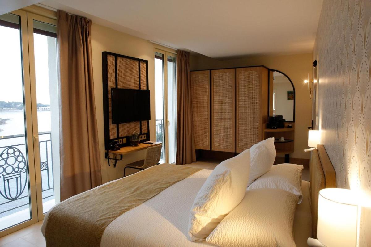 Un ou plusieurs lits dans un hébergement de l'établissement Splendid Hôtel & Spa