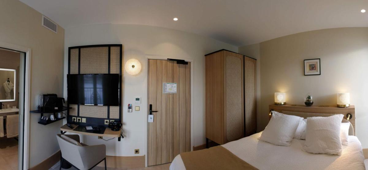 Un ou plusieurs lits dans un hébergement de l'établissement Splendid Hôtel & Spa