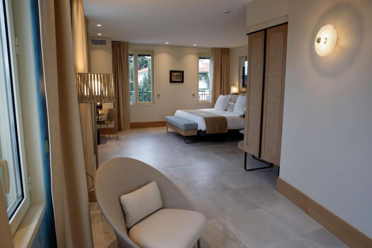 Un ou plusieurs lits dans un hébergement de l'établissement Splendid Hôtel & Spa