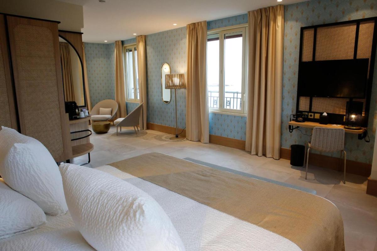 Un ou plusieurs lits dans un hébergement de l'établissement Splendid Hôtel & Spa