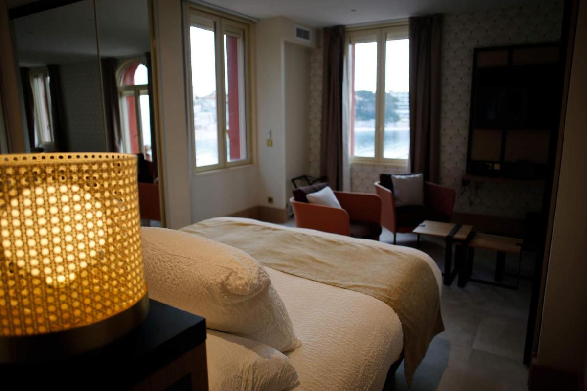 Un ou plusieurs lits dans un hébergement de l'établissement Splendid Hôtel & Spa