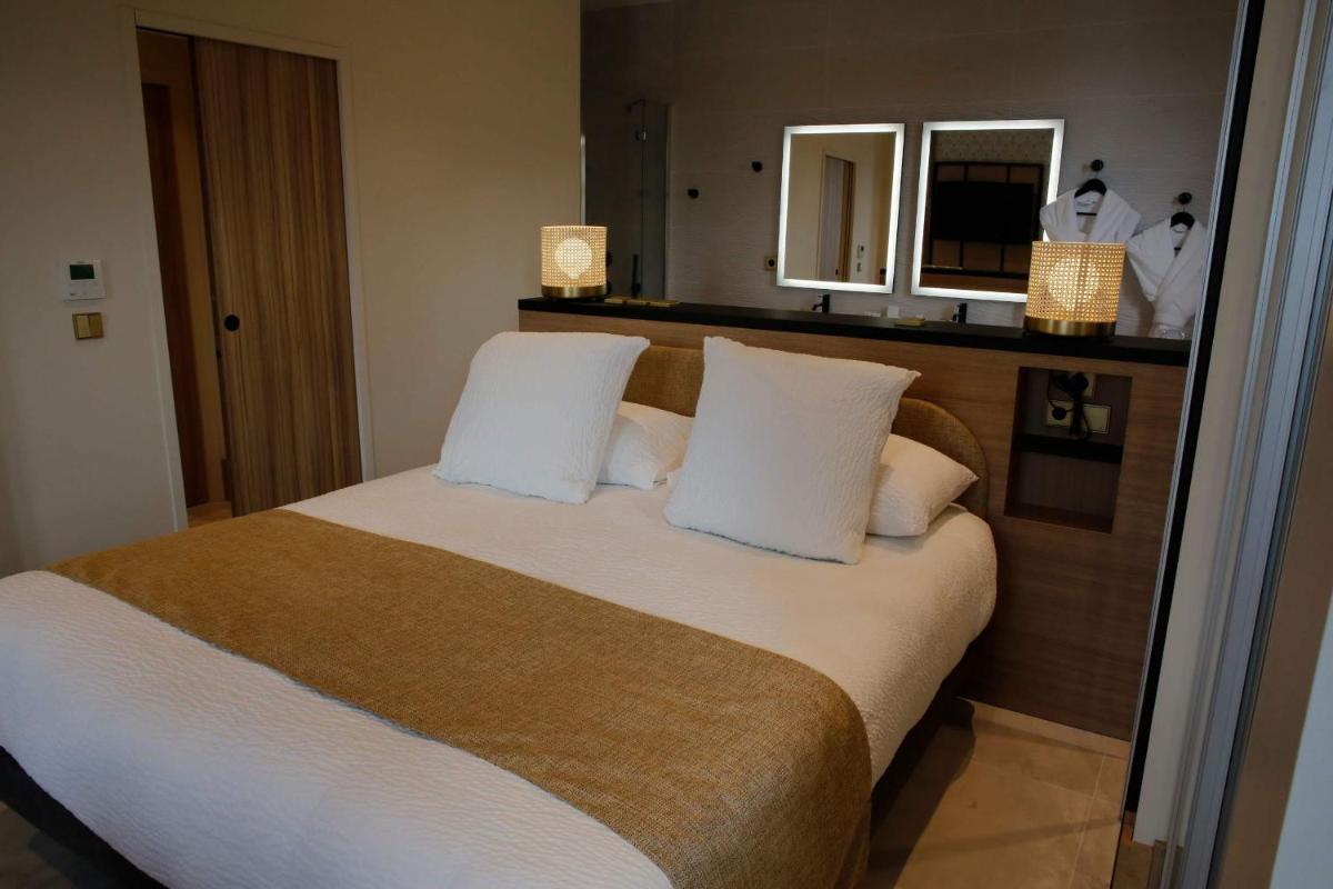 Un ou plusieurs lits dans un hébergement de l'établissement Splendid Hôtel & Spa