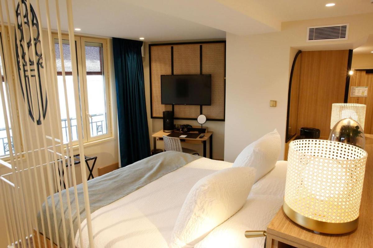 Un ou plusieurs lits dans un hébergement de l'établissement Splendid Hôtel & Spa