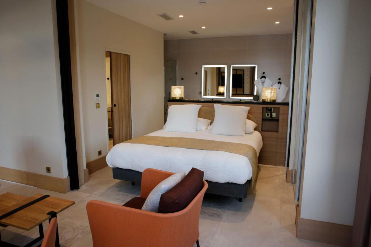 Un ou plusieurs lits dans un hébergement de l'établissement Splendid Hôtel & Spa