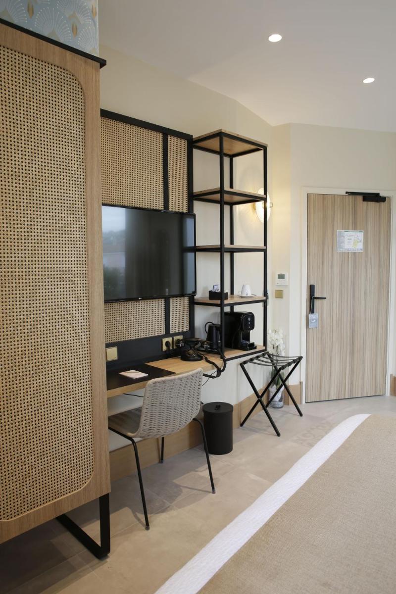 Télévision ou salle de divertissement dans l'établissement Splendid Hôtel & Spa