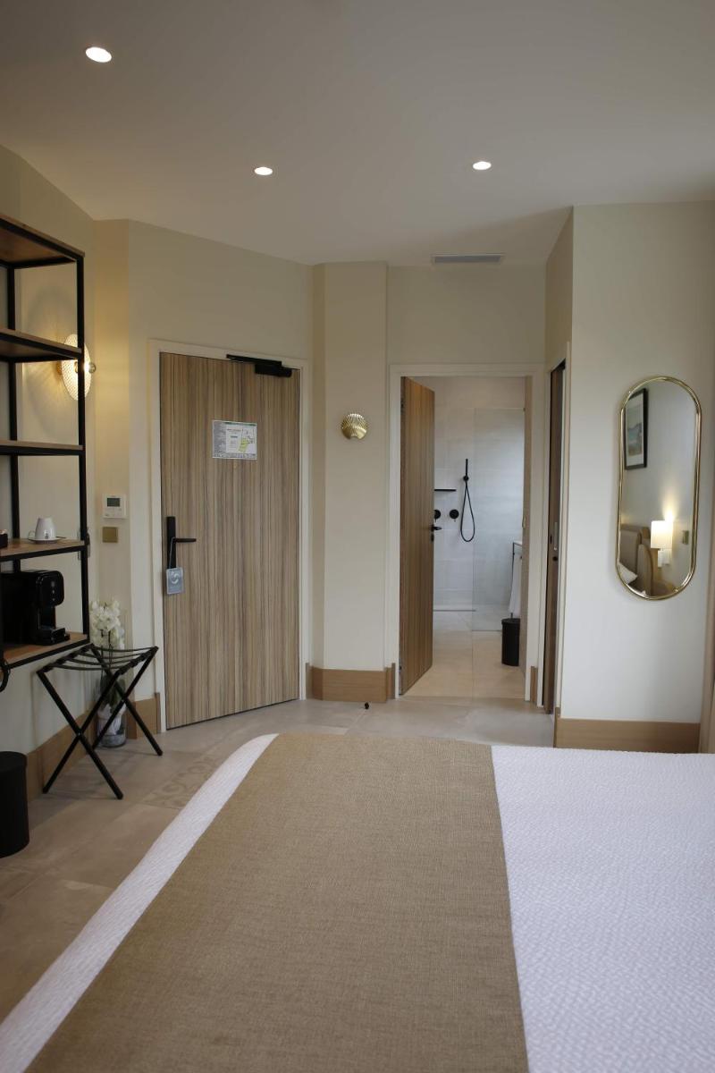 Un ou plusieurs lits dans un hébergement de l'établissement Splendid Hôtel & Spa
