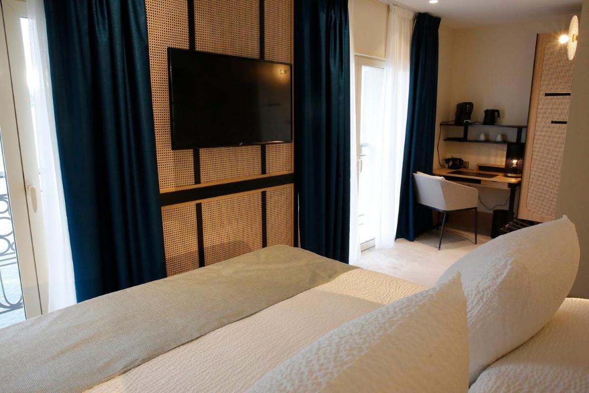 Télévision ou salle de divertissement dans l'établissement Splendid Hôtel & Spa
