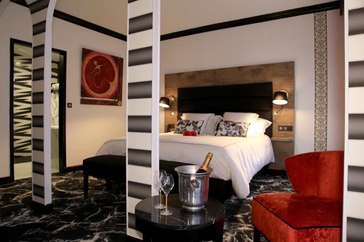 Un ou plusieurs lits dans un hébergement de l'établissement Hôtel du Barry Resort & Spa