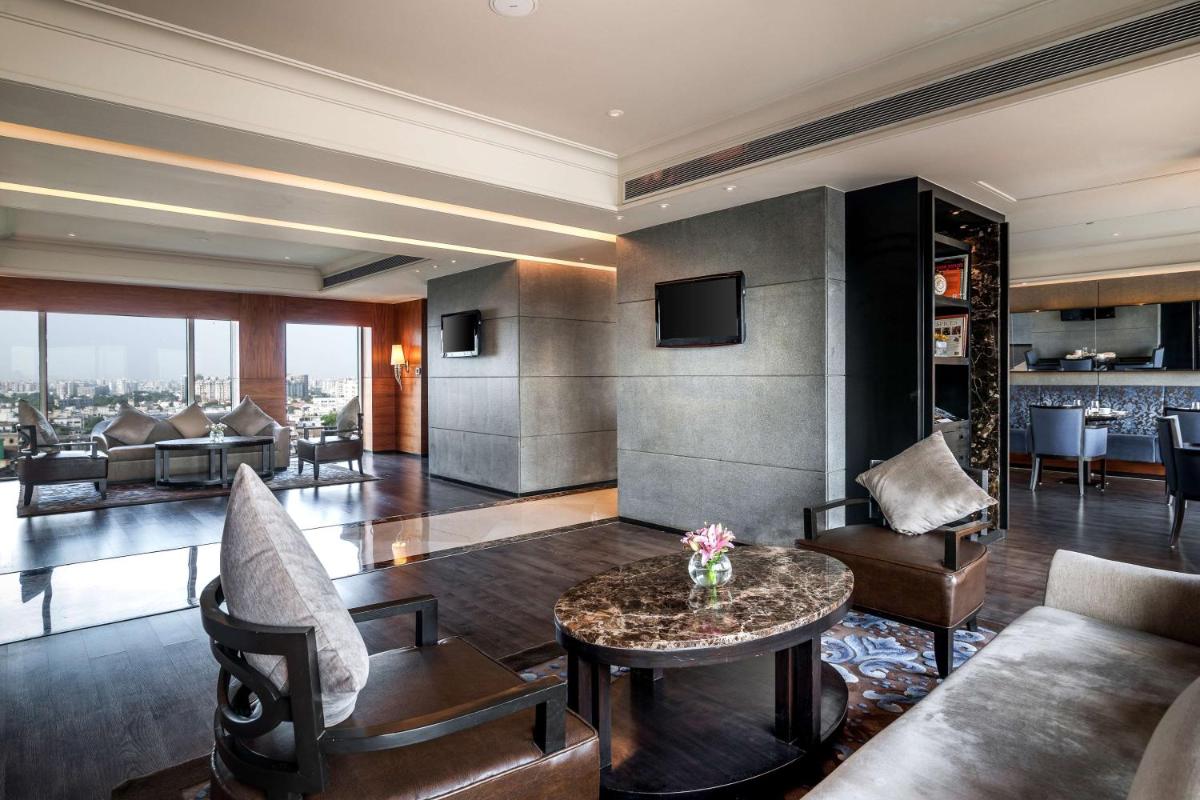 a living room with a couch and a table at Hyatt Ahmedabad in Ahmedabad