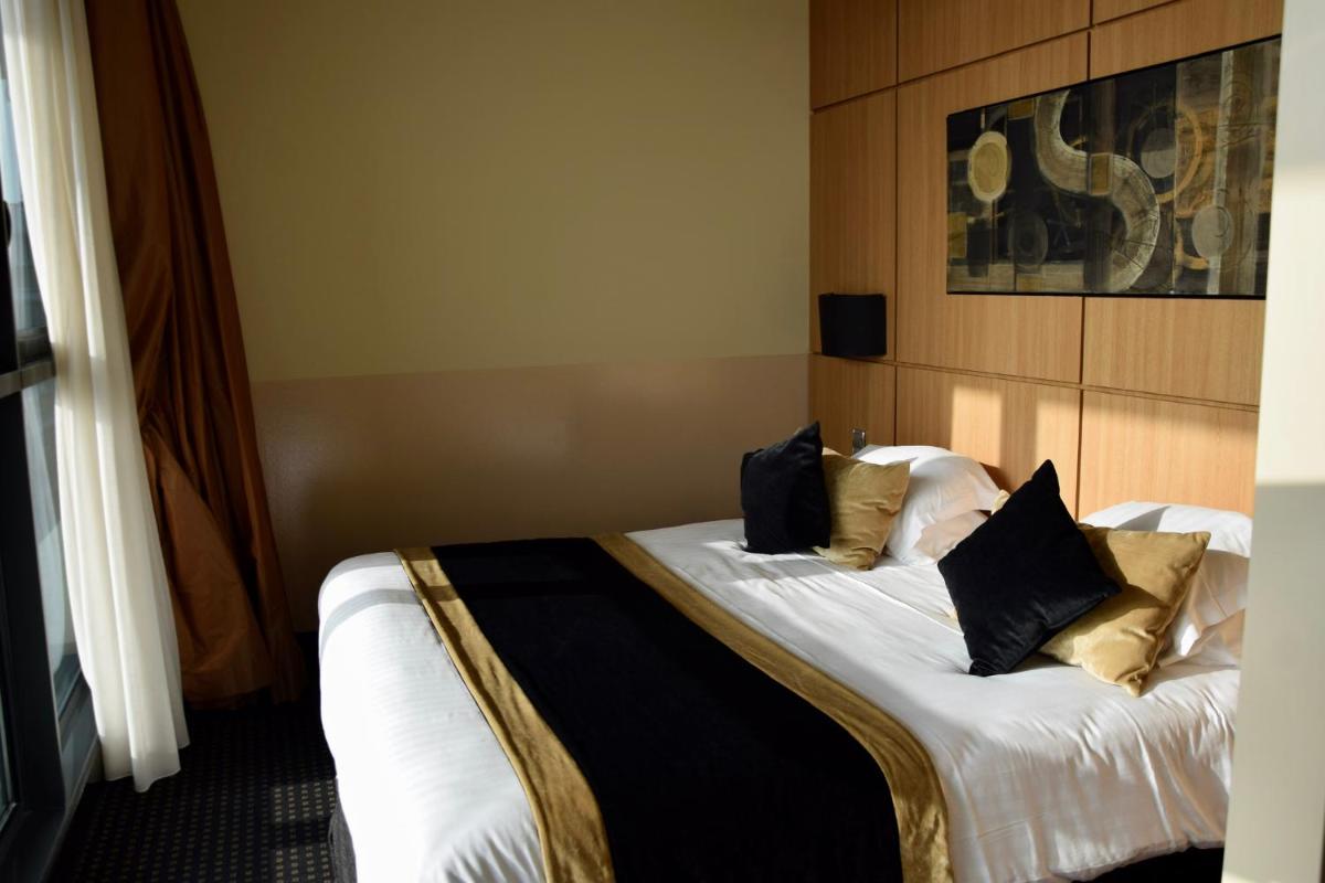 Un ou plusieurs lits dans un hébergement de l'établissement Hotel Spa Le Pasino