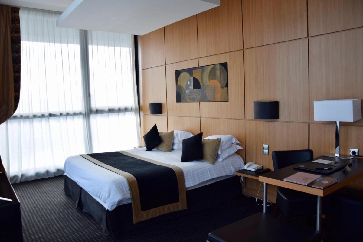 Un ou plusieurs lits dans un hébergement de l'établissement Hotel Spa Le Pasino
