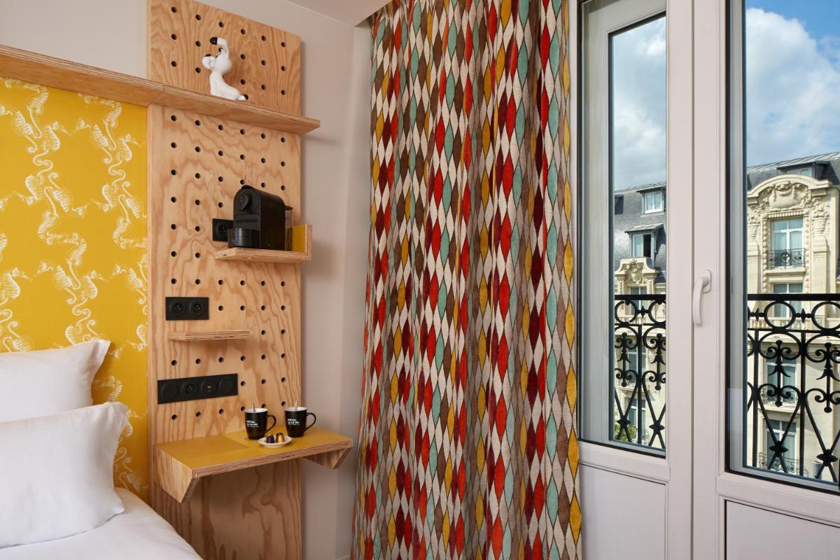 Un ou plusieurs lits dans un hébergement de l'établissement Hotel Locomo - Gare de Lyon Bastille