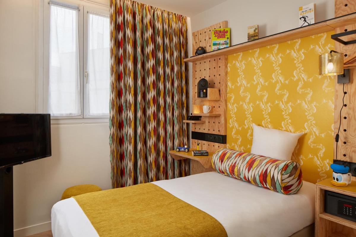 Un ou plusieurs lits dans un hébergement de l'établissement Hotel Locomo - Gare de Lyon Bastille