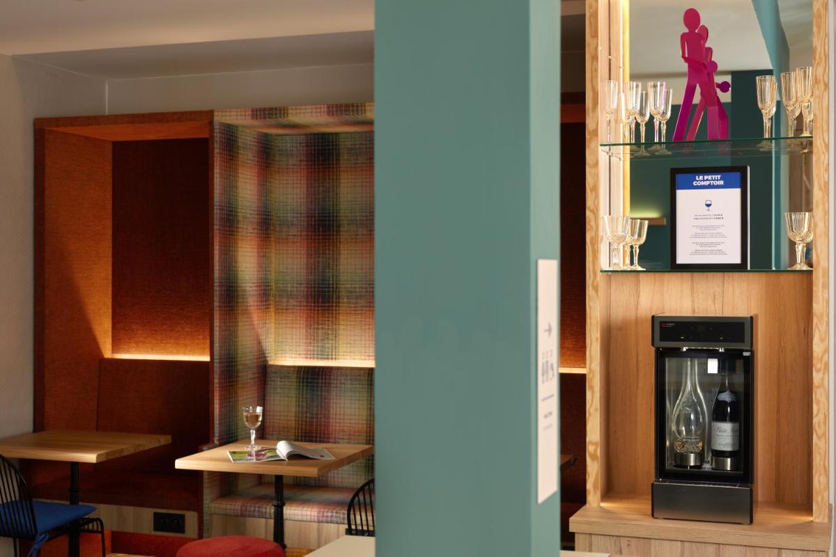 Télévision ou salle de divertissement dans l'établissement Hotel Locomo - Gare de Lyon Bastille