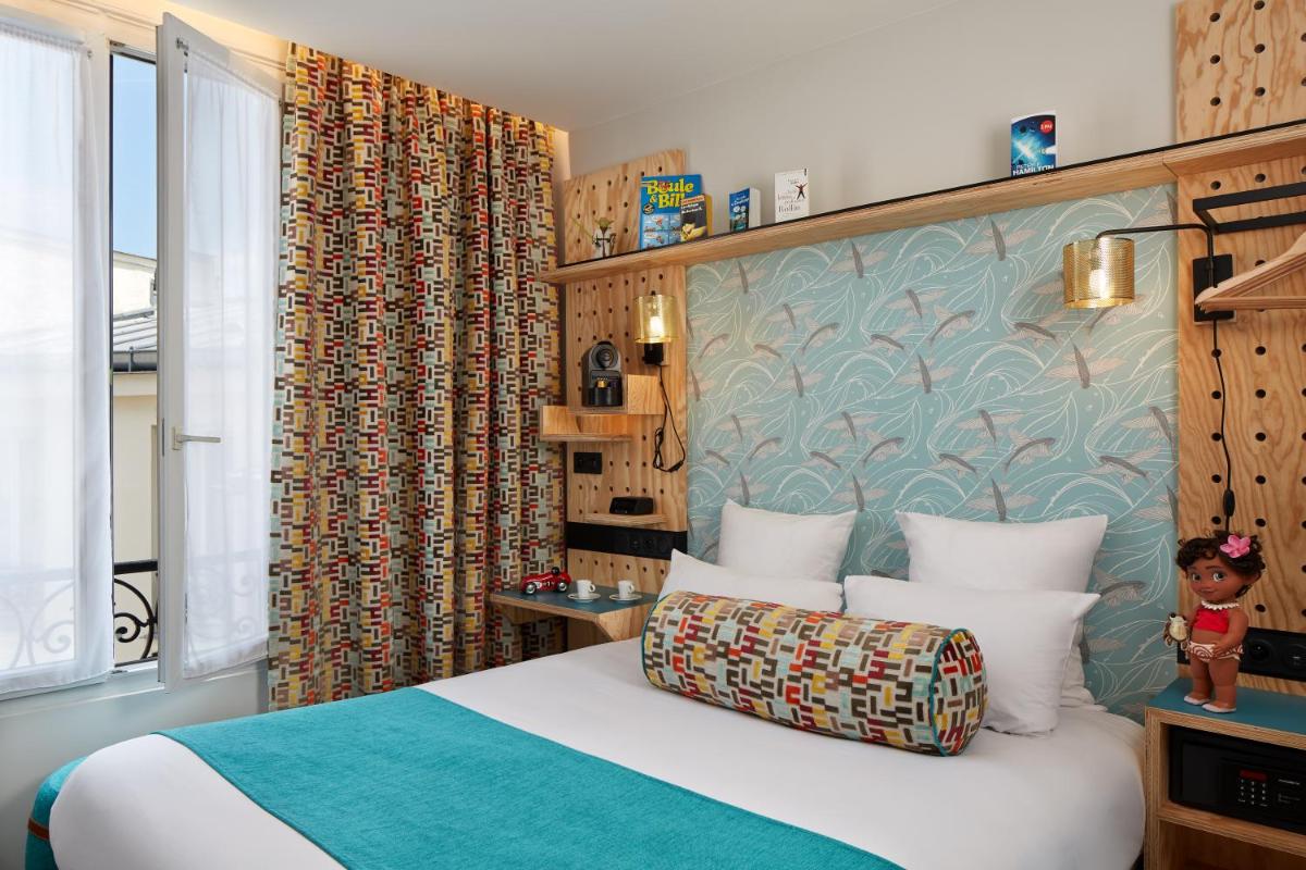 Un ou plusieurs lits dans un hébergement de l'établissement Hotel Locomo - Gare de Lyon Bastille