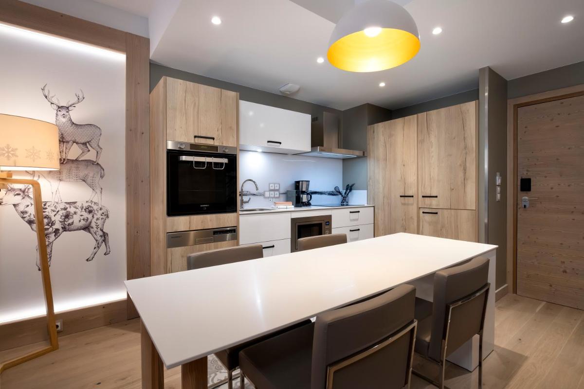 Cuisine ou kitchenette dans l'établissement Résidence Pierre & Vacances Premium L'Hévana