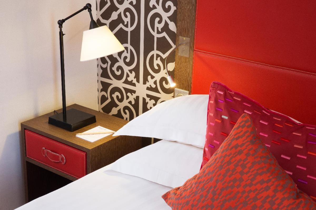 Un ou plusieurs lits dans un hébergement de l'établissement Hotel Phileas Lazare & Spa - Opera
