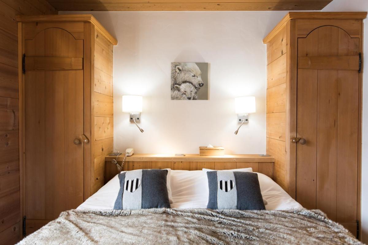 Un ou plusieurs lits dans un hébergement de l'établissement Les Chalets de La Griyotire