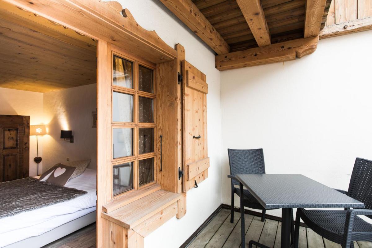 Un ou plusieurs lits dans un hébergement de l'établissement Les Chalets de La Griyotire