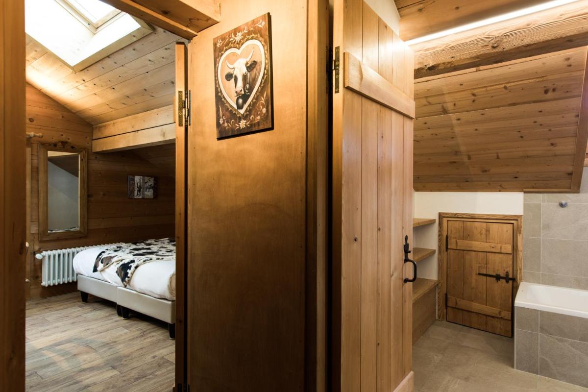 Un ou plusieurs lits dans un hébergement de l'établissement Les Chalets de La Griyotire