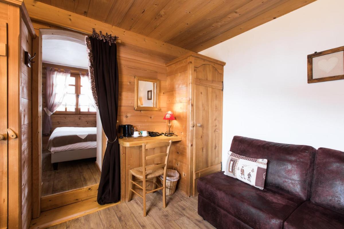 Un ou plusieurs lits dans un hébergement de l'établissement Les Chalets de La Griyotire
