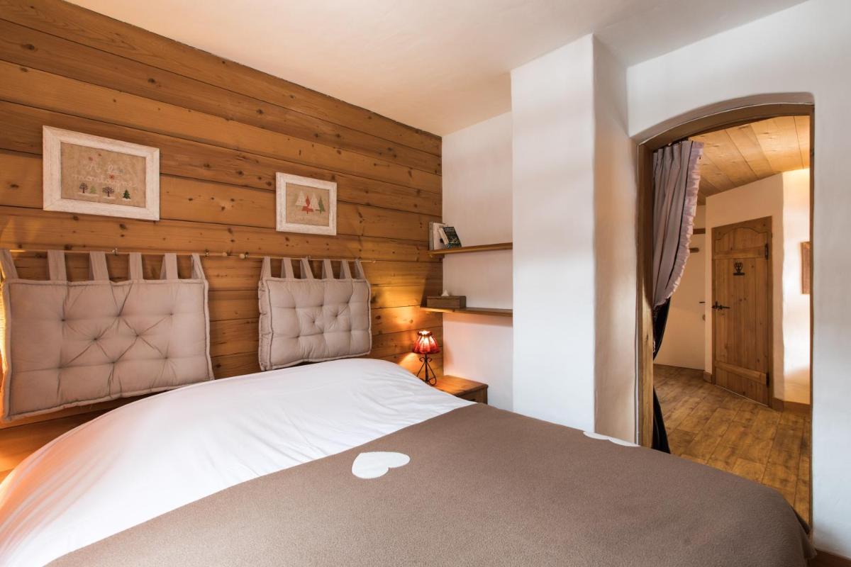 Un ou plusieurs lits dans un hébergement de l'établissement Les Chalets de La Griyotire