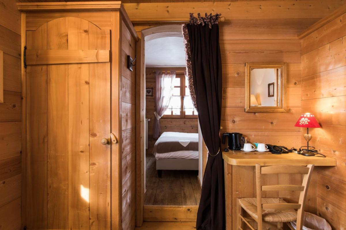 Un ou plusieurs lits dans un hébergement de l'établissement Les Chalets de La Griyotire