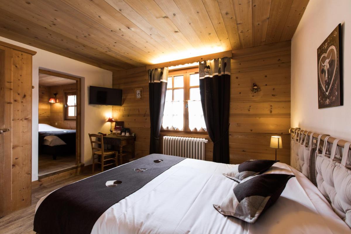 Un ou plusieurs lits dans un hébergement de l'établissement Les Chalets de La Griyotire