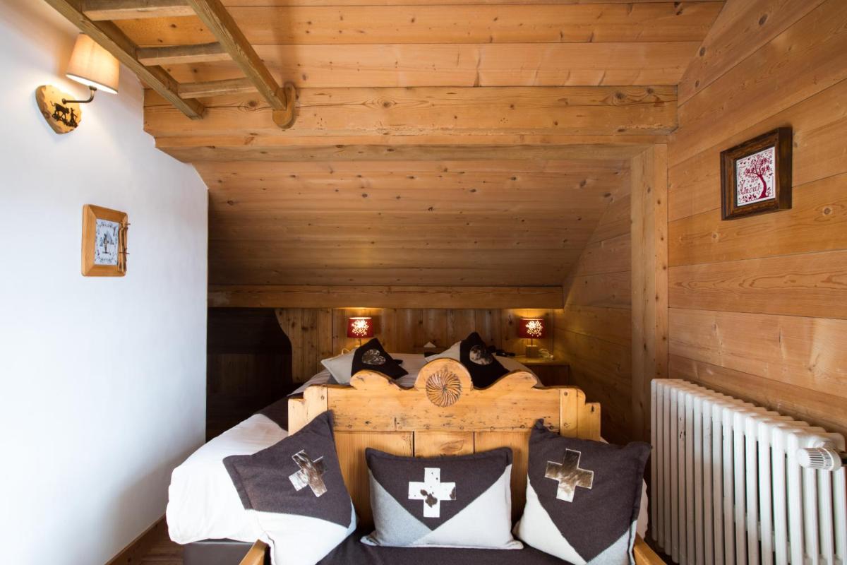 Un ou plusieurs lits dans un hébergement de l'établissement Les Chalets de La Griyotire