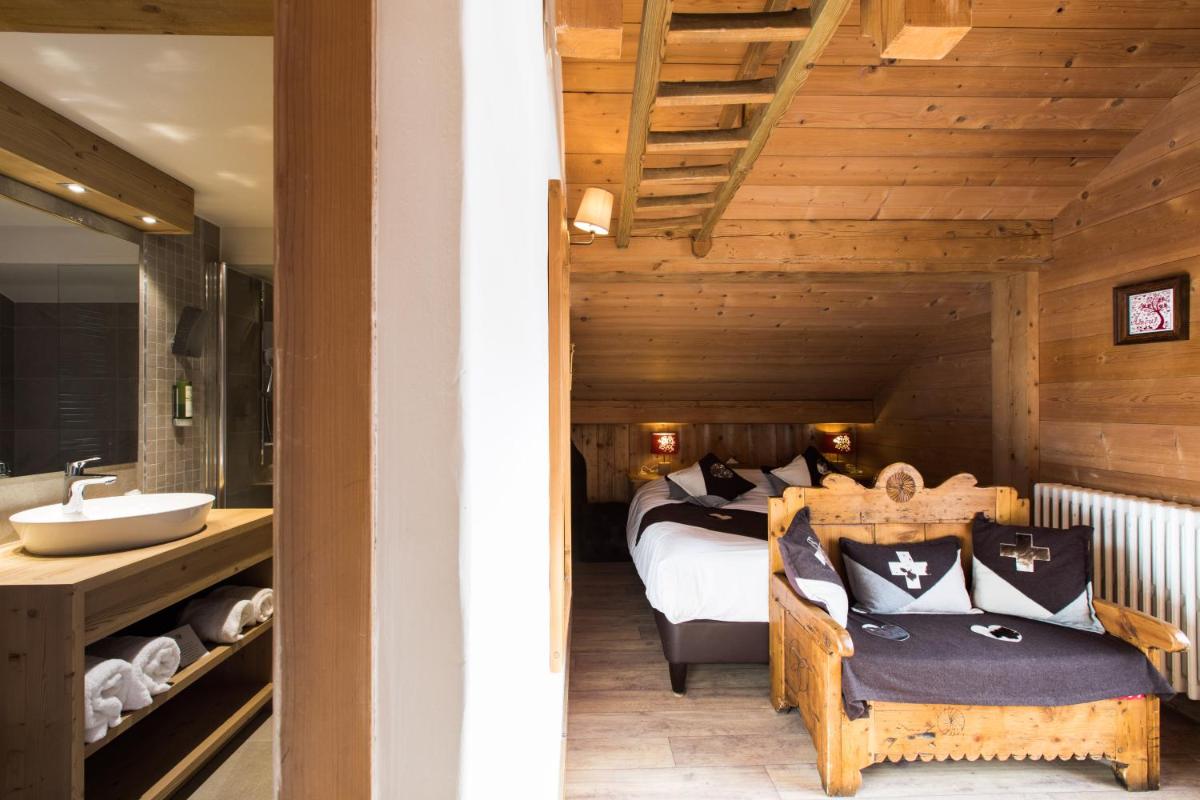Un ou plusieurs lits dans un hébergement de l'établissement Les Chalets de La Griyotire