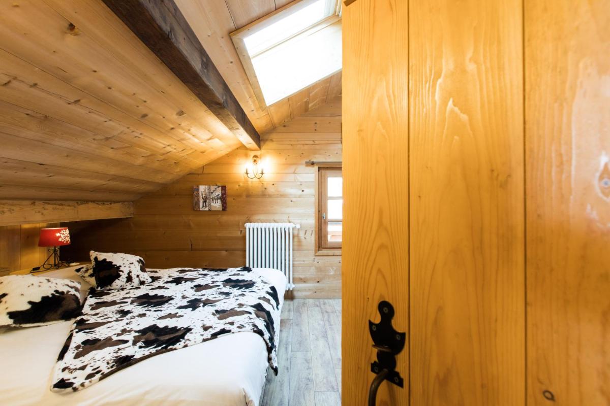 Un ou plusieurs lits dans un hébergement de l'établissement Les Chalets de La Griyotire