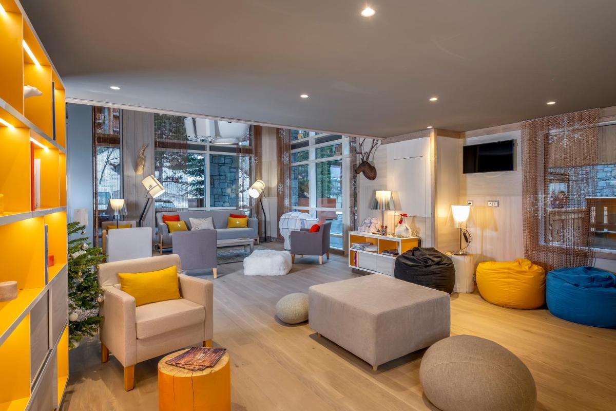 Coin salon dans l'établissement Résidence Pierre & Vacances Premium L'Hévana